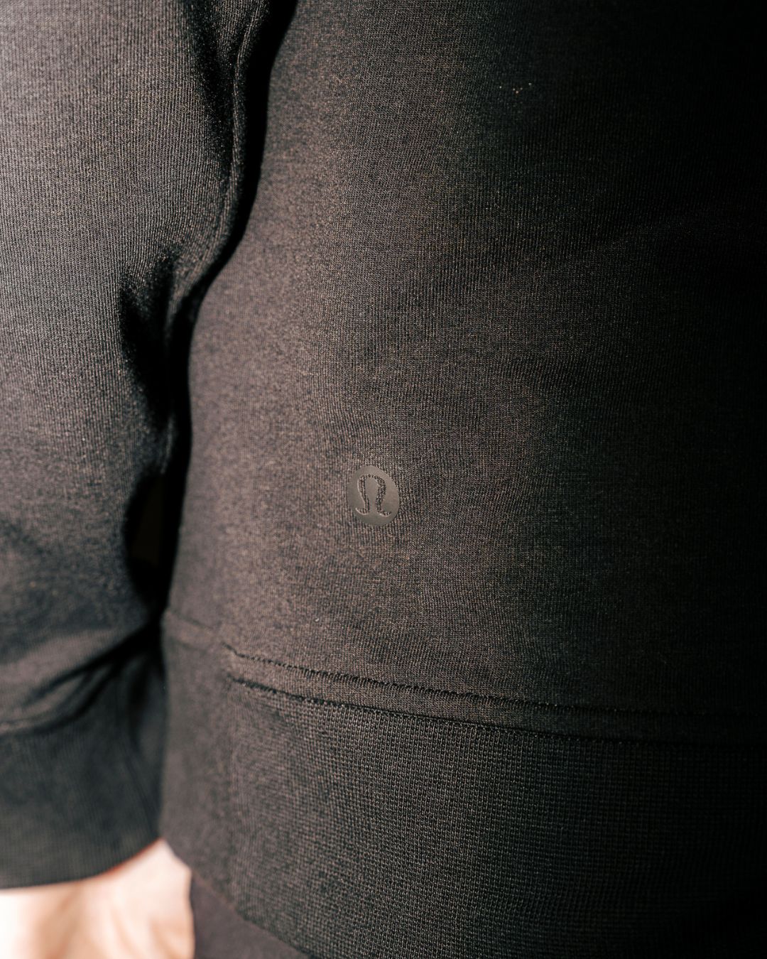 Close up of Lululemon logo on city sweat pullover hoodie.